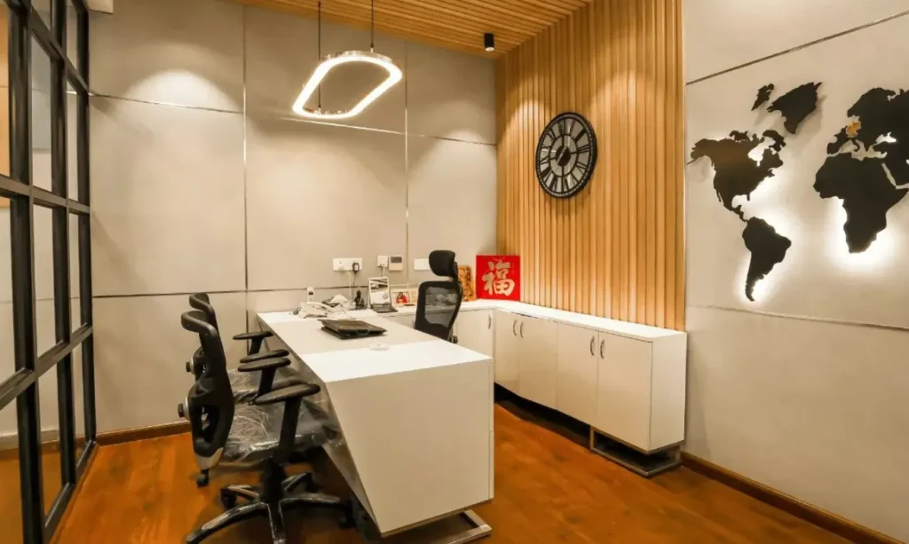 A modern office with a world map on the wall.